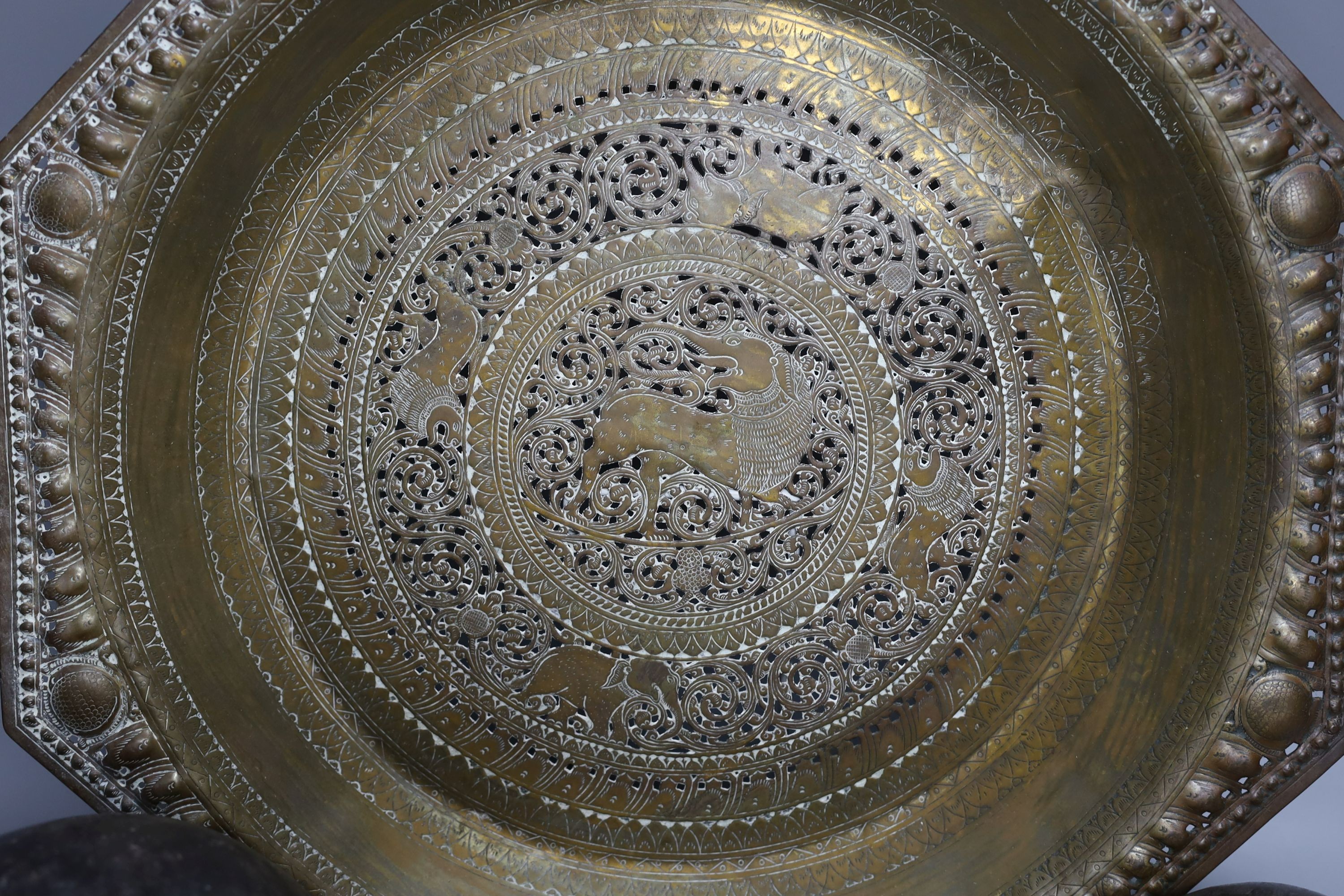Metalware to include - a Sino-Tibetan bronze amulet, a Bidri ware dish, a Chinese paktong handwarmer Asian wood balls with inset coins etc